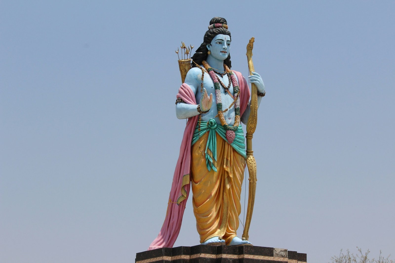 woman in green and brown dress statue