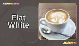 A steaming cup of Flat White coffee served in a ceramic cup, showcasing a creamy layer of microfoam with delicate latte art on top